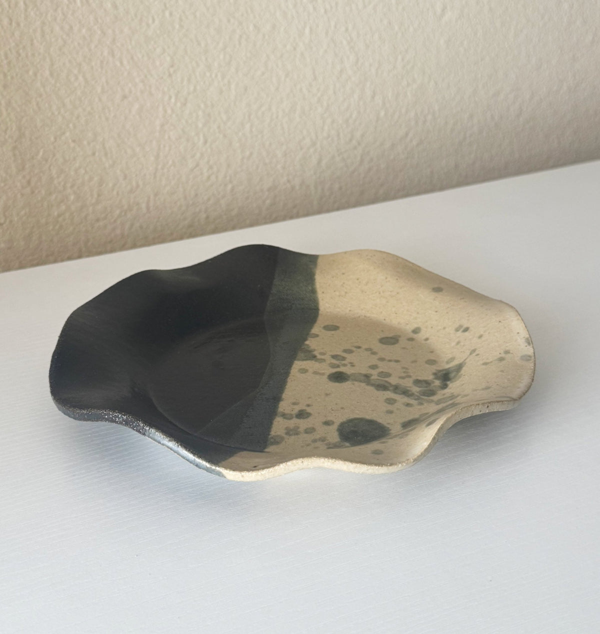Handmade Ceramic Wavy Plate in Natural/Black Splatter Color Block, 8.5" - Bordeaux Ceramics
